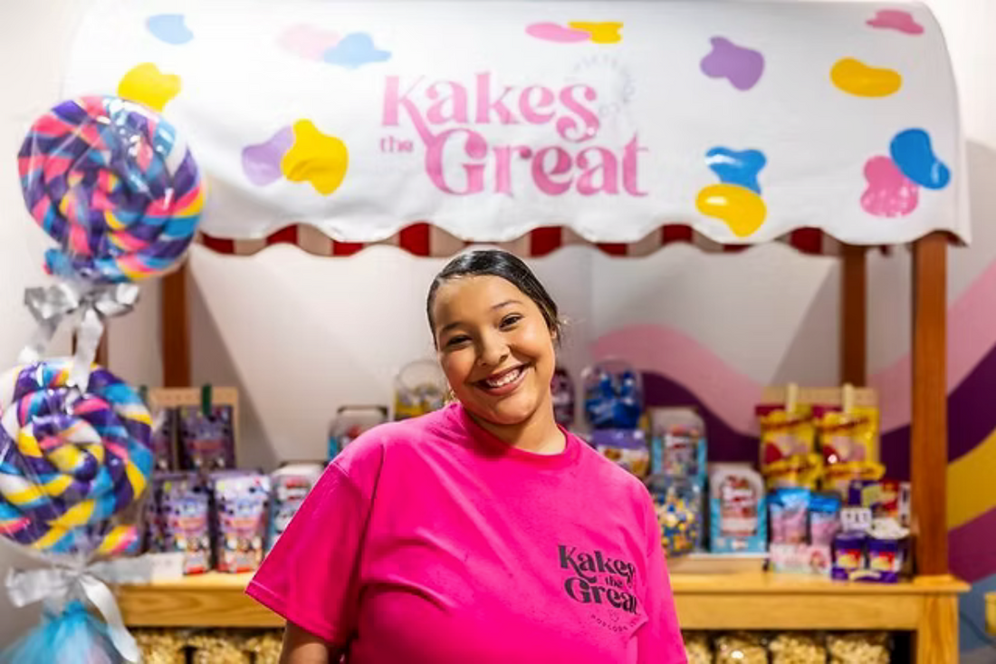 Kaylynn Martin, owner of Kakes the Great standing in front of the rolling cart in her Popcorn shop in the SVRC Marketplace. 